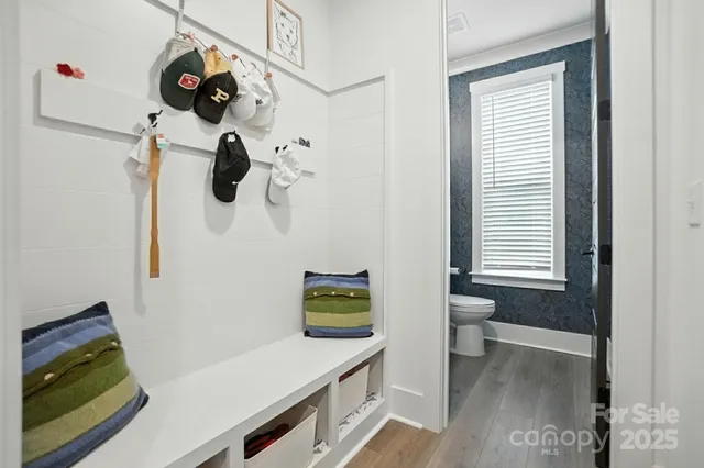 a bathroom with a toilet and a shower curtain