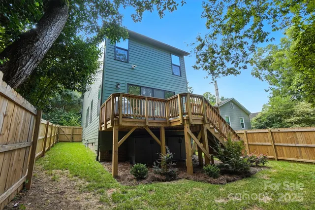 a house that has a tree in front of it