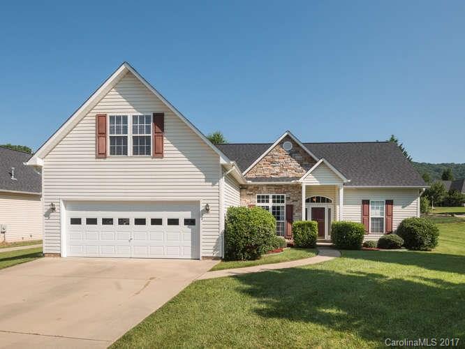 8 Morning Mist Road Fletcher, NC 28732 - Photo 1 of 24 a front view of a house with a yard and garage