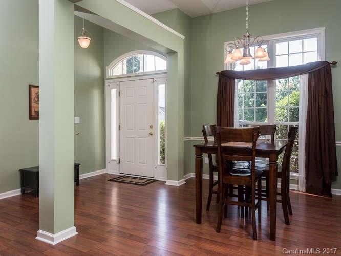 8 Morning Mist Road Fletcher, NC 28732 - Photo 2 of 24 a view of a dining room with furniture window and wooden floor