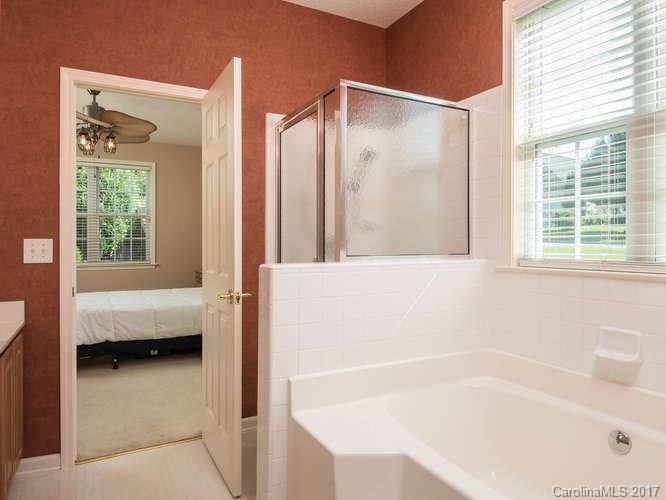 8 Morning Mist Road Fletcher, NC 28732 - Photo 11 of 24 a bathroom with a bathtub and a shower