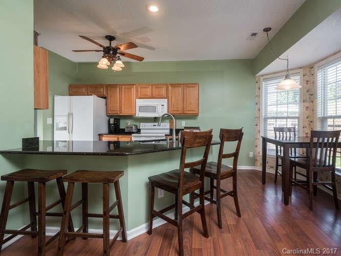 8 Morning Mist Road Fletcher, NC 28732 - Photo 5 of 24 a view of a dining room with furniture and wooden floor