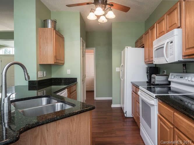 8 Morning Mist Road Fletcher, NC 28732 - Photo 6 of 24 a kitchen with stainless steel appliances granite countertop a sink a stove and a refrigerator