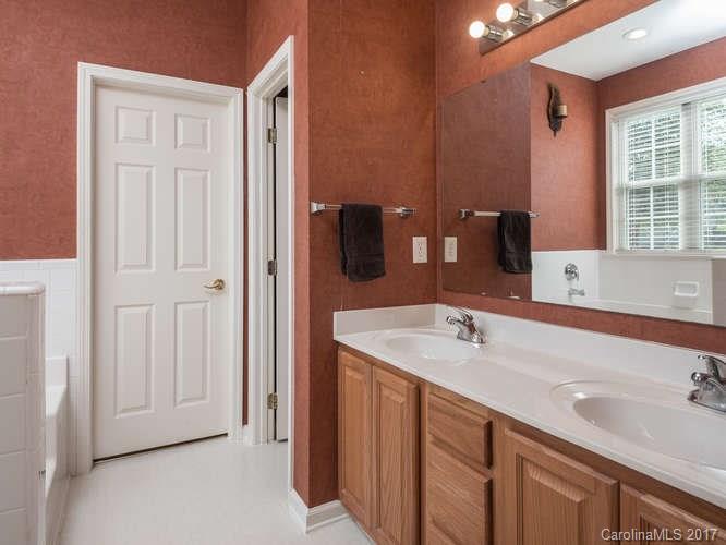 8 Morning Mist Road Fletcher, NC 28732 - Photo 10 of 24 a bathroom with a sink and a large mirror