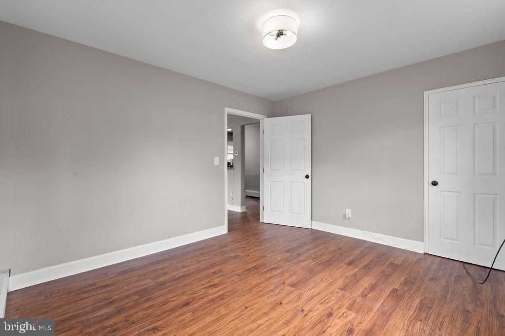 38 4th Street Laurel, MD 20707 - Photo 12 of 27 a view of an empty room with wooden floor