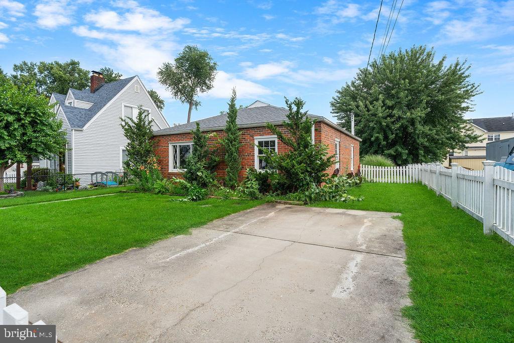 38 4th Street Laurel, MD 20707 - Photo 20 of 27 a front view of house with yard and green space