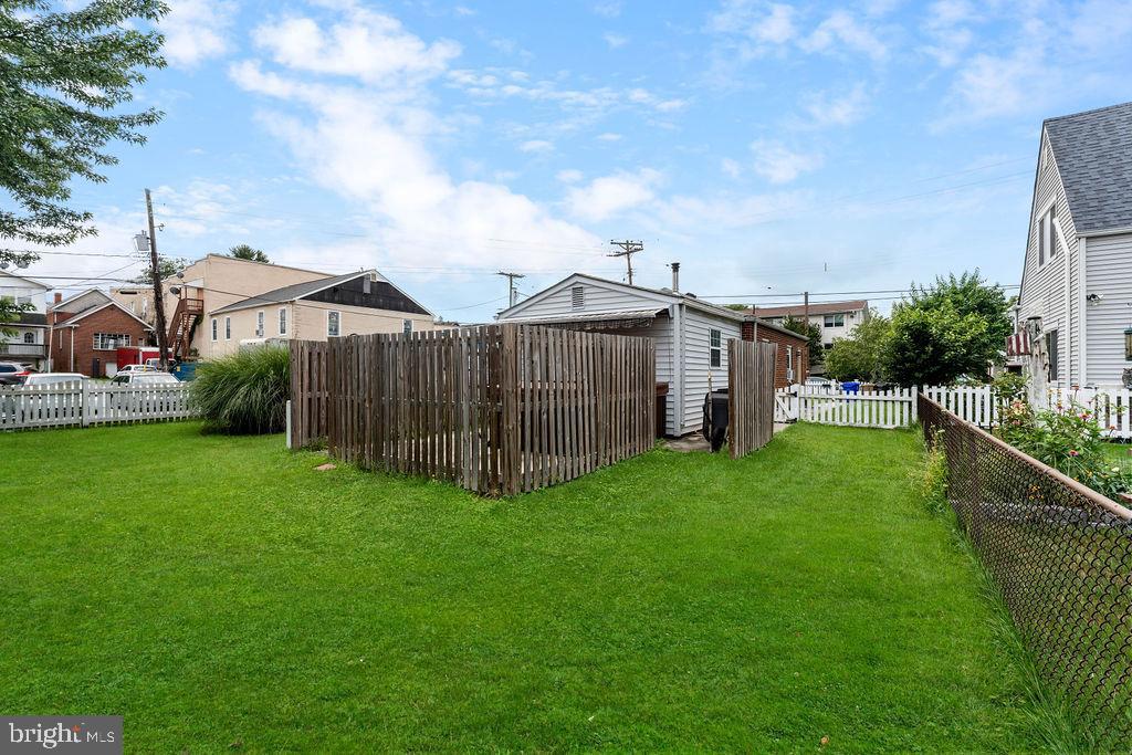 38 4th Street Laurel, MD 20707 - Photo 23 of 27 a view of a barn with big yard and large trees