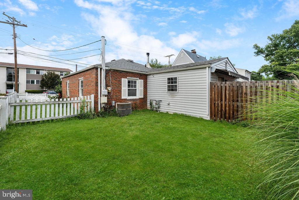 38 4th Street Laurel, MD 20707 - Photo 24 of 27 a view of a house with a yard and a garden
