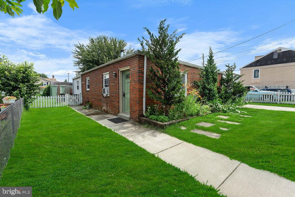 38 4th Street Laurel, MD 20707 - Photo 26 of 27 a front view of house with yard and green space