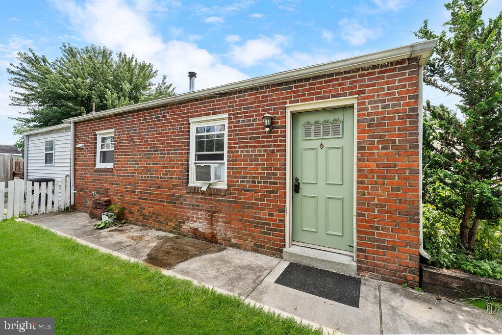 38 4th Street Laurel, MD 20707 - Photo 27 of 27 a front view of a house with a garden