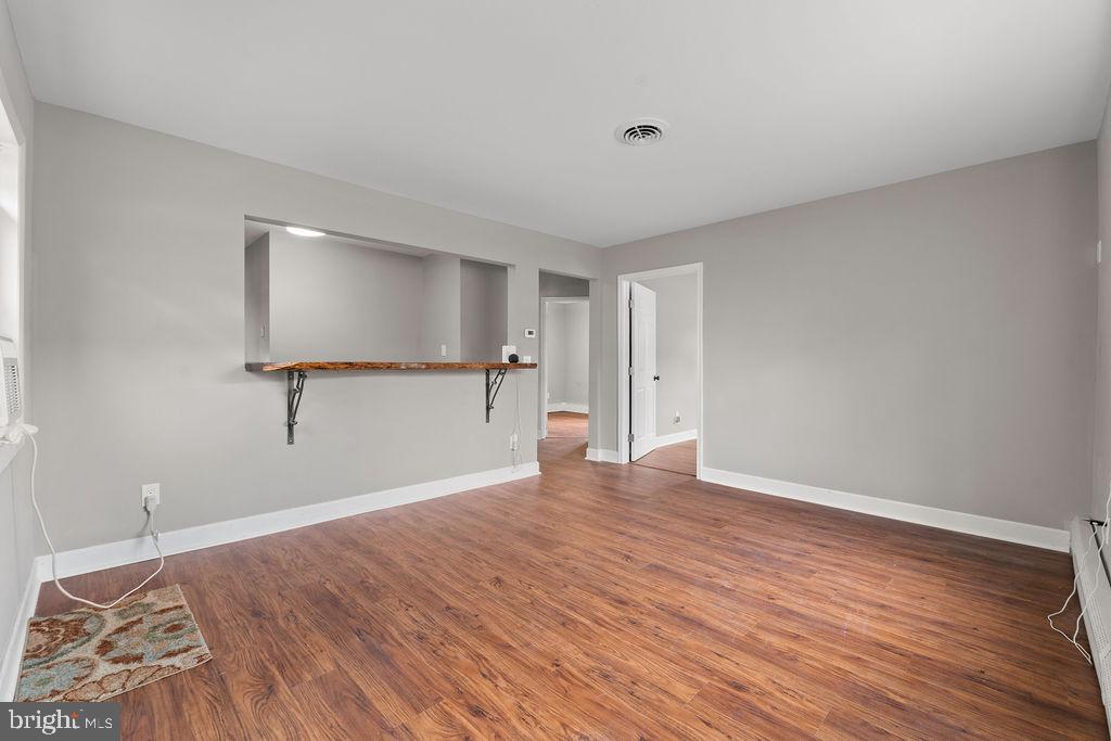 38 4th Street Laurel, MD 20707 - Photo 5 of 27 a view of empty room with wooden floor