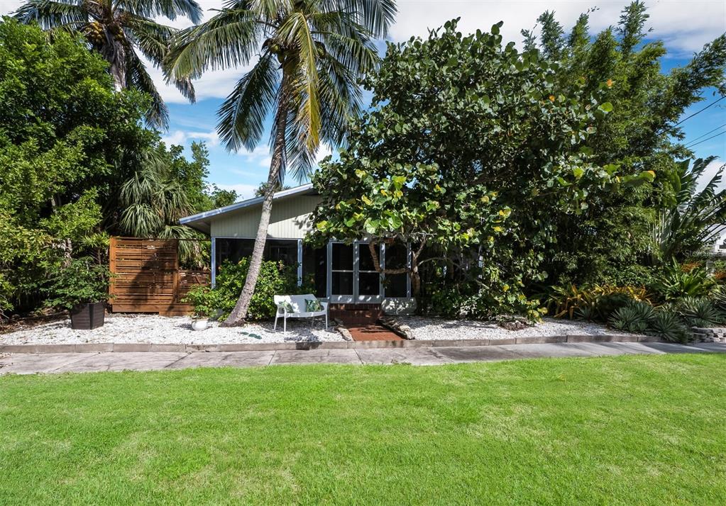 Private oasis at this charming coquina block bungalow on Broadway
