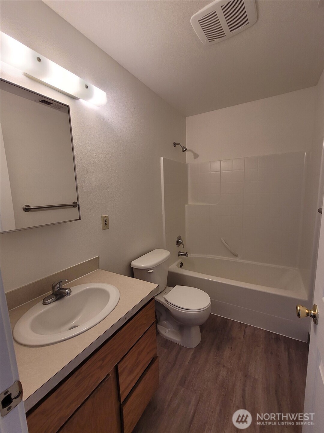 1830 West Crouse Street Moses Lake, WA 98837 - Photo 17 of 17 a bathroom with a sink toilet a mirror and shower