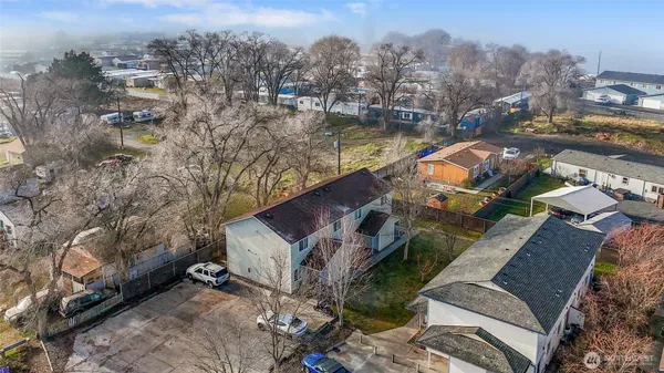 an aerial view of a house with outdoor space