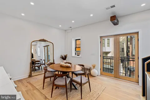 a kitchen with granite countertop a sink a stove and cabinets
