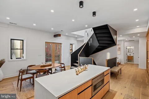 a kitchen with a sink and cabinets