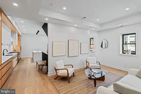 a bedroom with bed and a large window