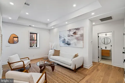 a bedroom with a large bed and a large window