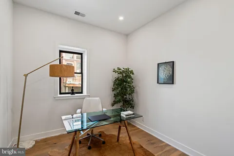 a view of a balcony with chairs