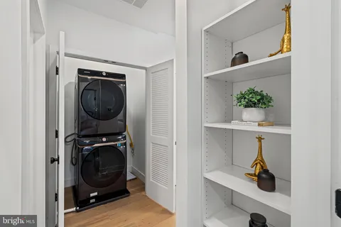 a bathroom with a sink mirror toilet and shower