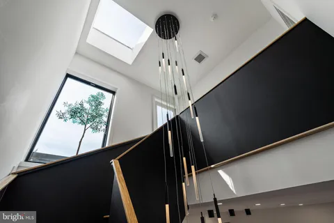 a spacious bathroom with a double vanity sink and a mirror