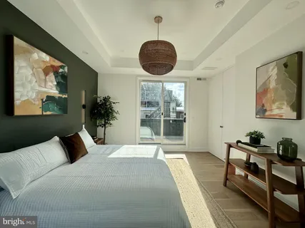 a bathroom with a double vanity sink toilet and shower