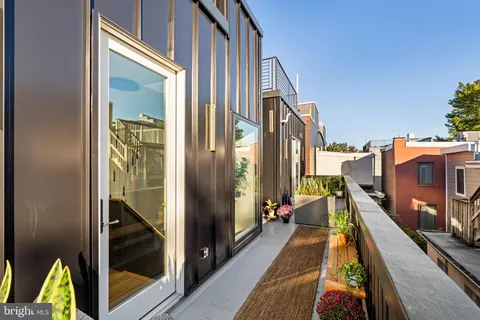 a view of a balcony with chairs