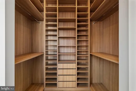 a bed room with a bed and a mirror