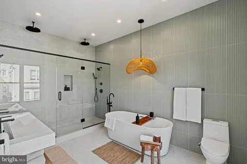 a bathroom with a bathtub and a shower
