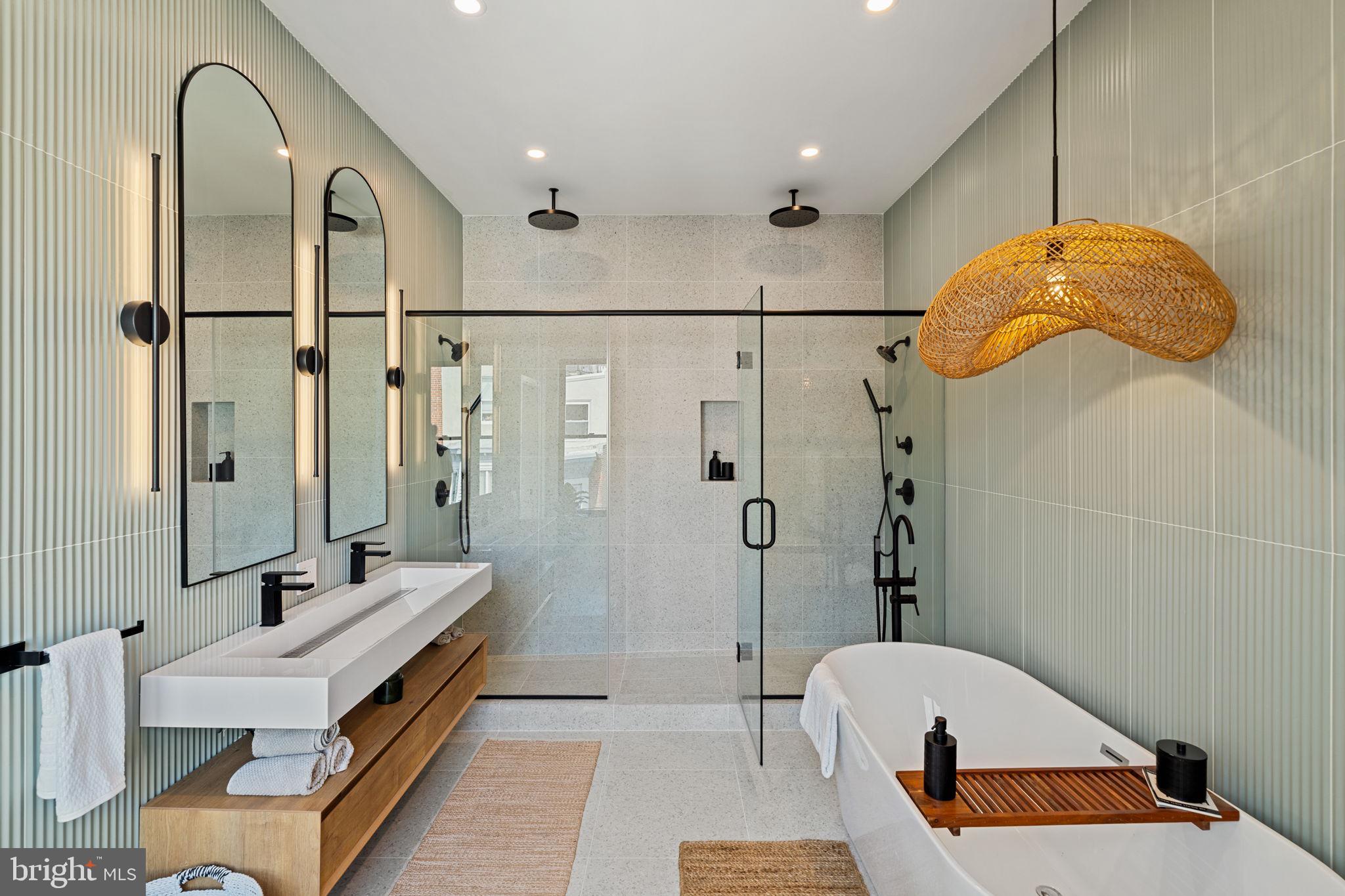 1914 Wilcox Street Philadelphia, PA 19130 - Photo 44 of 70 a bathroom with a sink a mirror and a shower