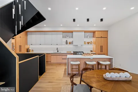a view of a dining room with furniture and a window