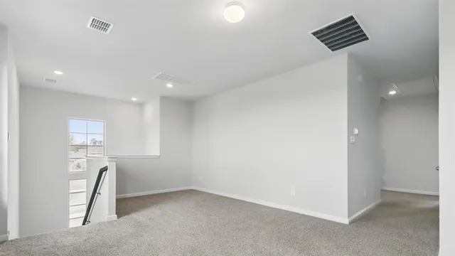 a view of staircase with white walls