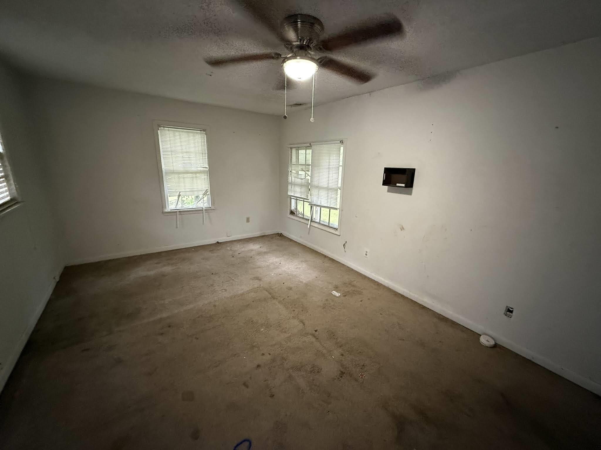 8488 Quito Road Millington, TN 38053 - Photo 12 of 30 an empty room with a empty space and windows