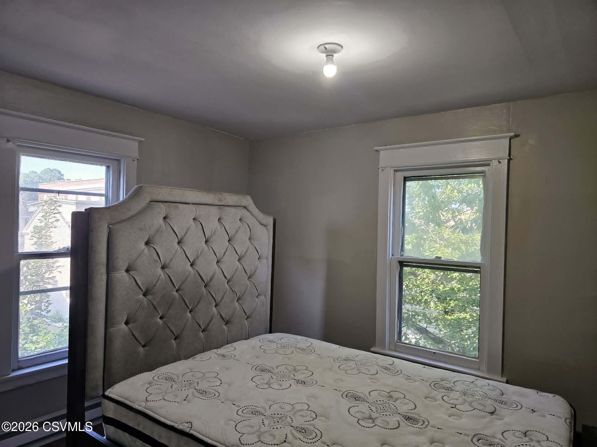 110 Birch Street Shamokin, PA 17872 - Photo 15 of 19 a bedroom with a bed and a window