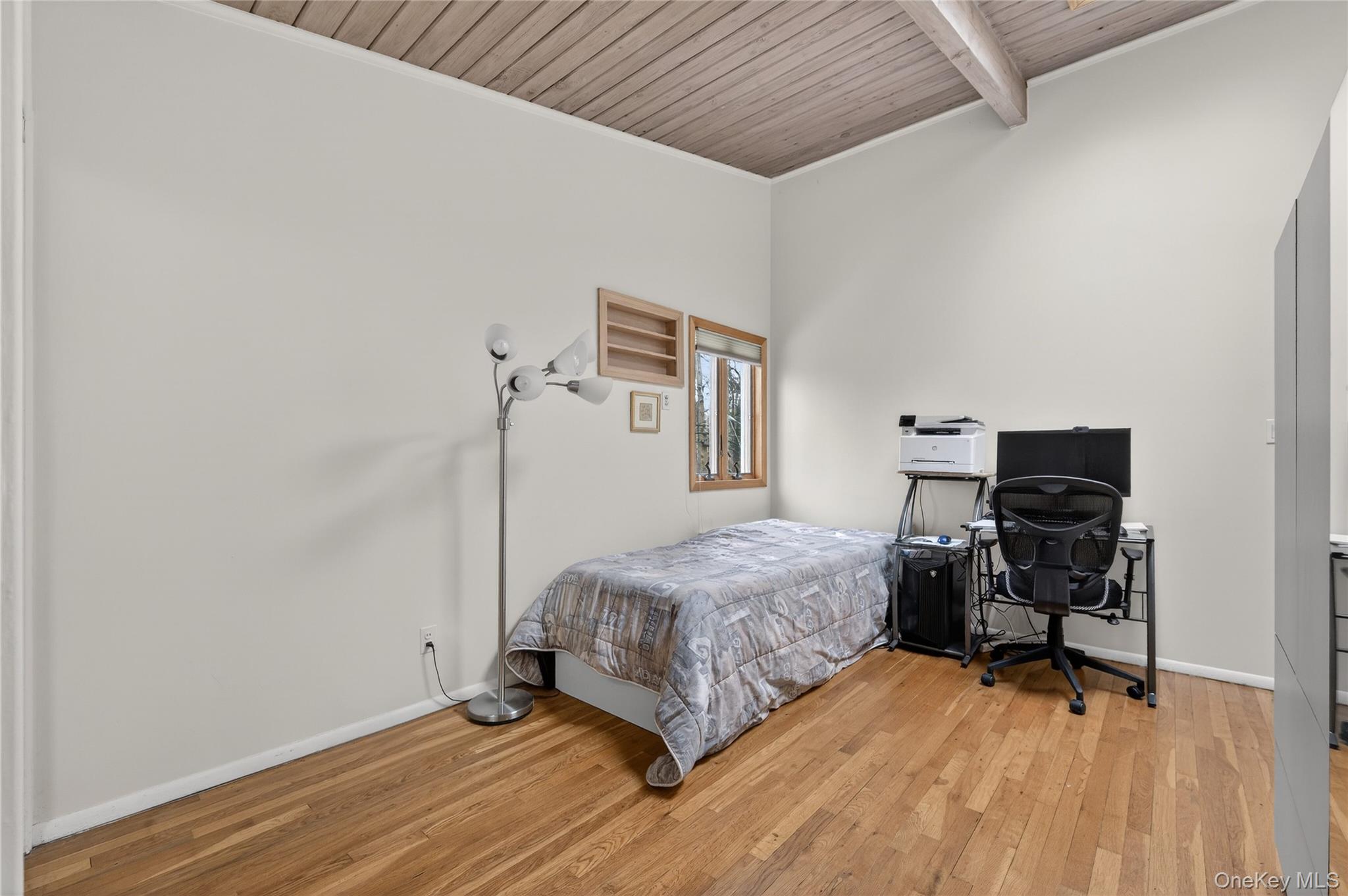 43 Highwood Road East Norwich, NY 11732 - Photo 14 of 32 a bedroom with a bed and a desk