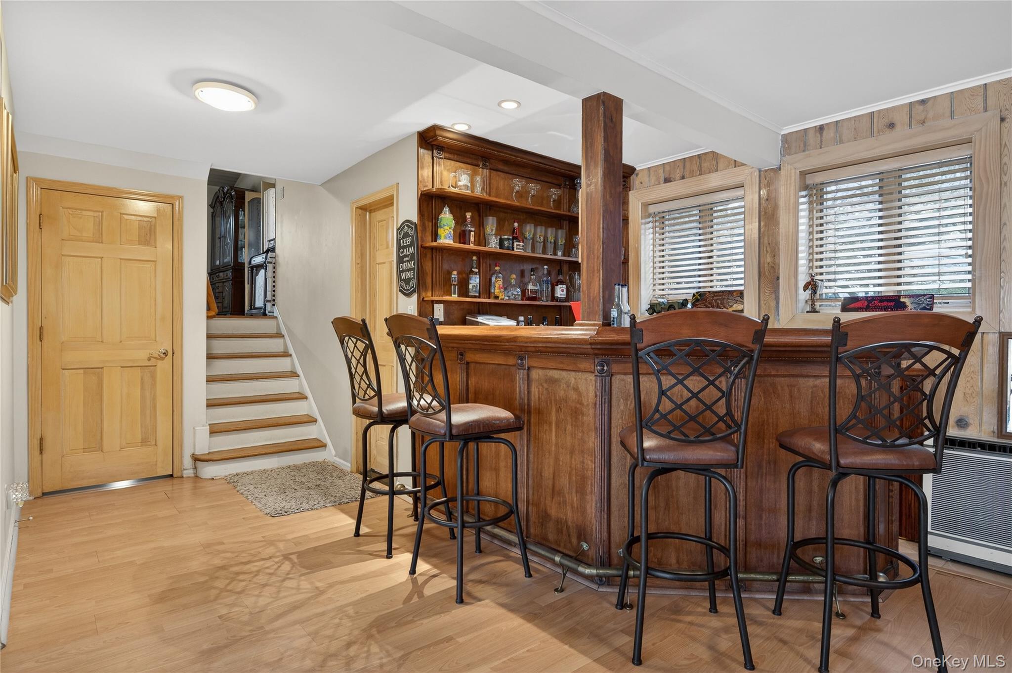 43 Highwood Road East Norwich, NY 11732 - Photo 18 of 32 a view of a dining room with furniture and wooden floor