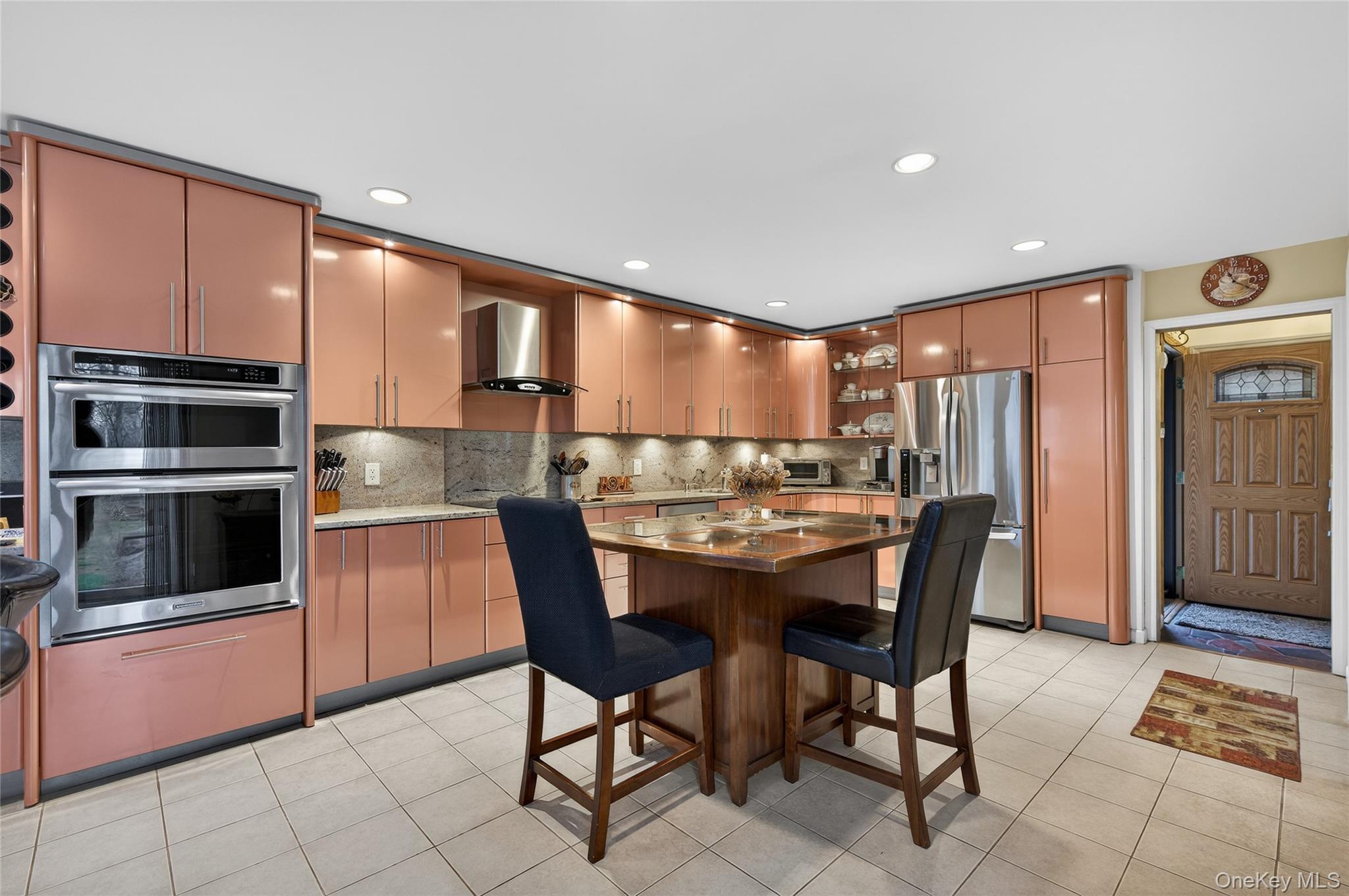43 Highwood Road East Norwich, NY 11732 - Photo 8 of 32 a large kitchen with a table and chairs