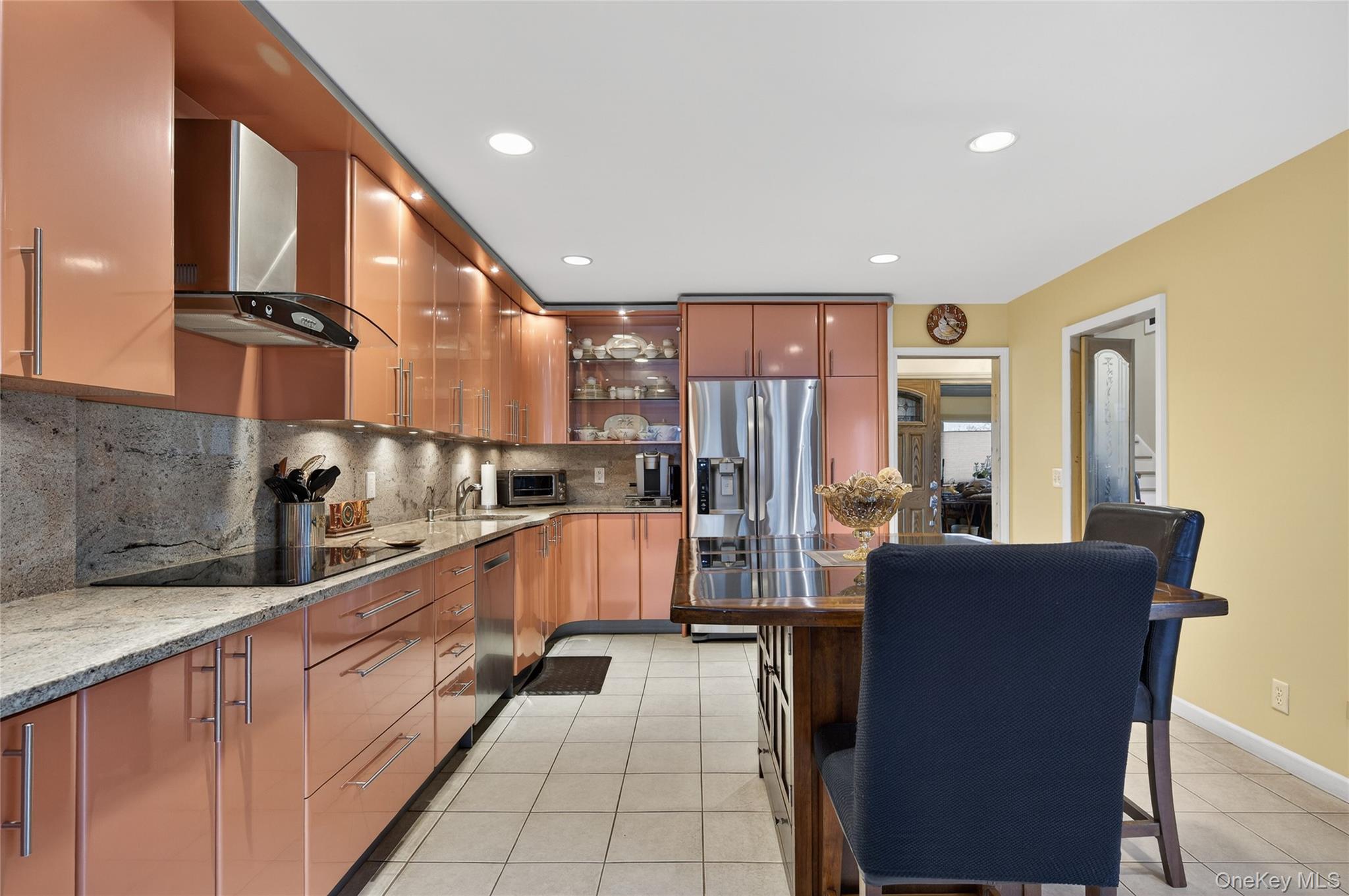 43 Highwood Road East Norwich, NY 11732 - Photo 9 of 32 a large kitchen with stainless steel appliances lots of counter space and windows