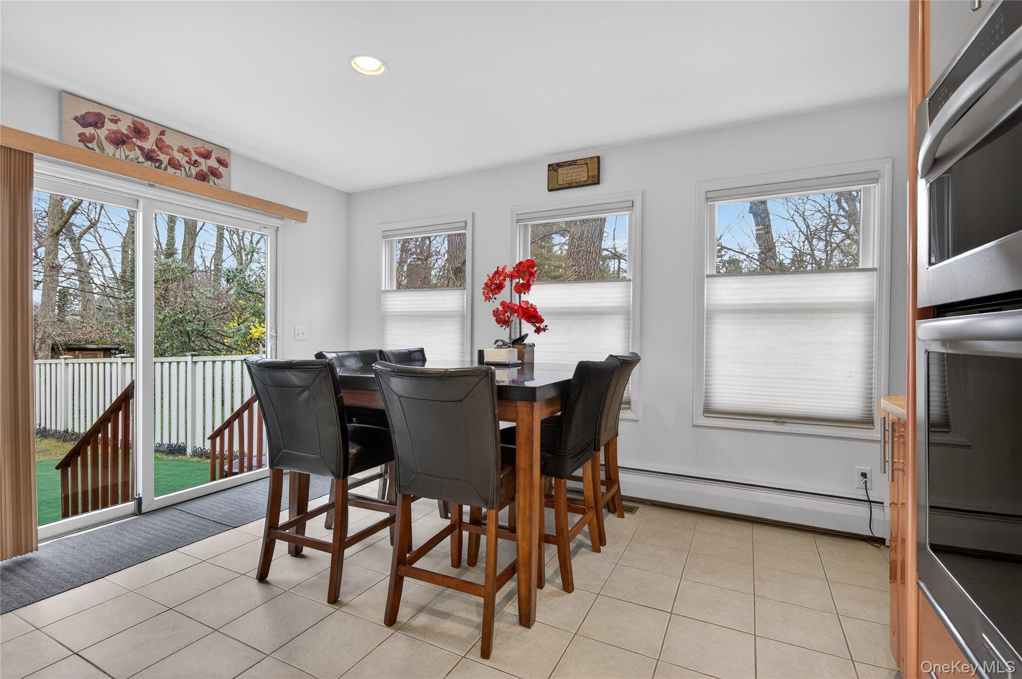 43 Highwood Road East Norwich, NY 11732 - Photo 10 of 32 a view of a dining room with furniture and a window