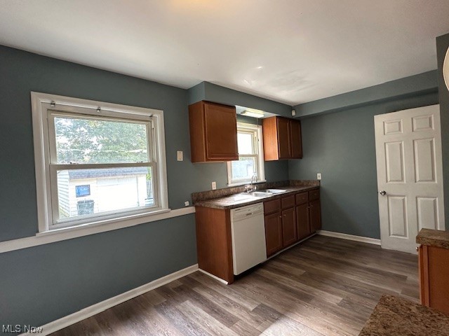 4230 Bluestone Road South Euclid, OH 44121 - Photo 4 of 35 Kitchen with sink, dark hardwood floors, white dishwasher, and plenty of natural light