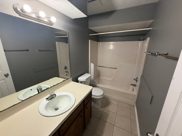 1610 Hazelwood Street, Unit A Conroe, TX 77301 - Photo 9 of 10 a bathroom with a sink and mirror with toilet