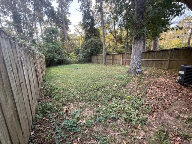 1610 Hazelwood Street, Unit A Conroe, TX 77301 - Photo 10 of 10 a view of a backyard with a trees