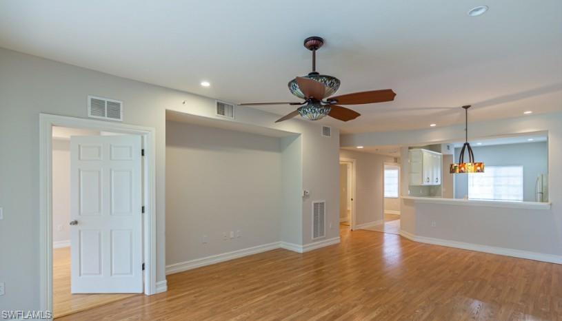 a view of an empty room and wooden floor