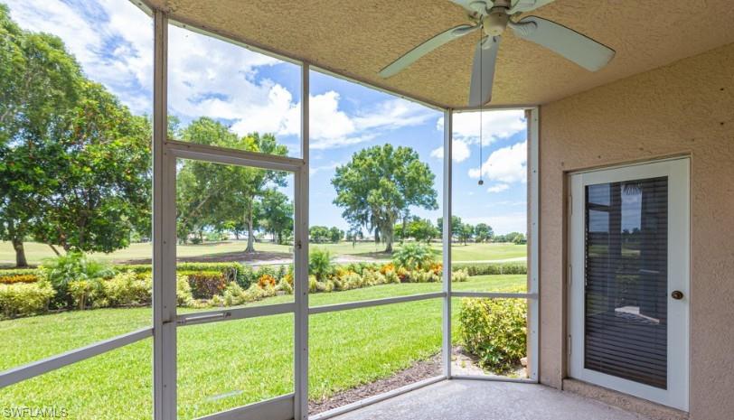 9113 Michael Circle, Unit 9 Naples, FL 34113 - Photo 24 of 28 a view of a room with a big yard
