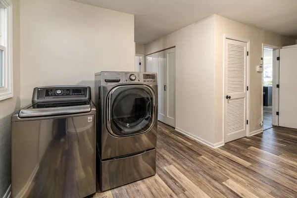 a bathroom with a double vanity sink and mirror