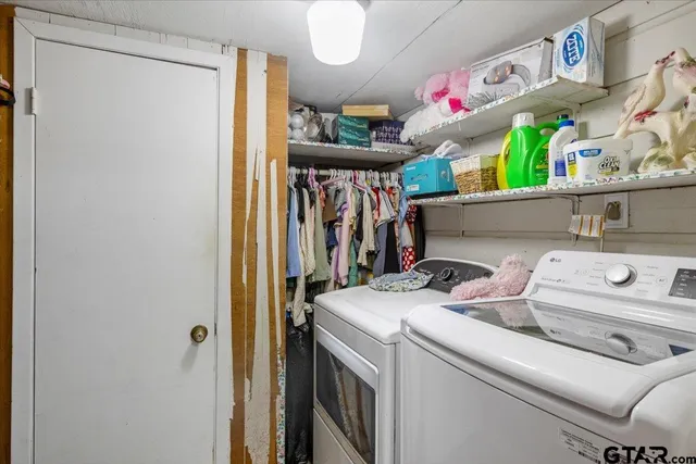 a utility room with dryer and washer
