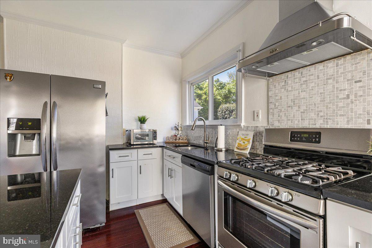 28 Jefferson Road Princeton, NJ 08540 - Photo 12 of 25 a kitchen with stainless steel appliances a sink a stove and a refrigerator
