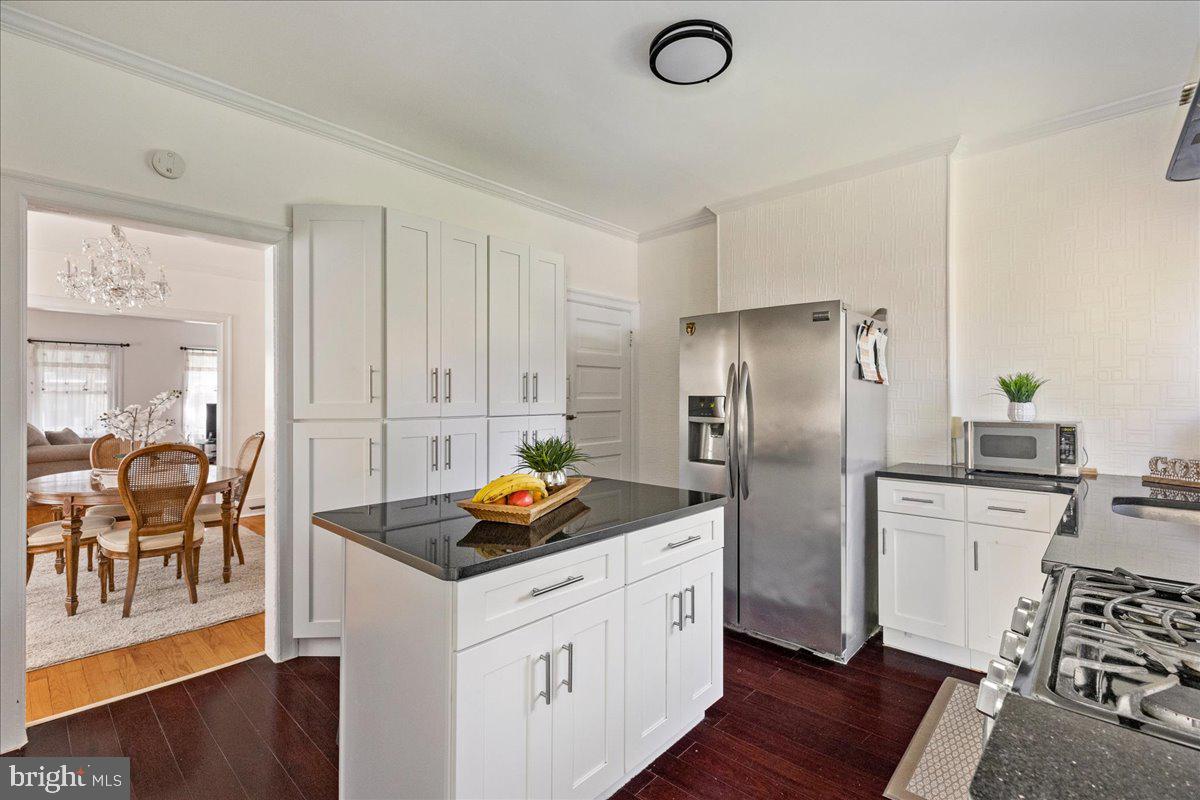 28 Jefferson Road Princeton, NJ 08540 - Photo 13 of 25 a kitchen with stainless steel appliances granite countertop a refrigerator a stove and white cabinets with wooden floor