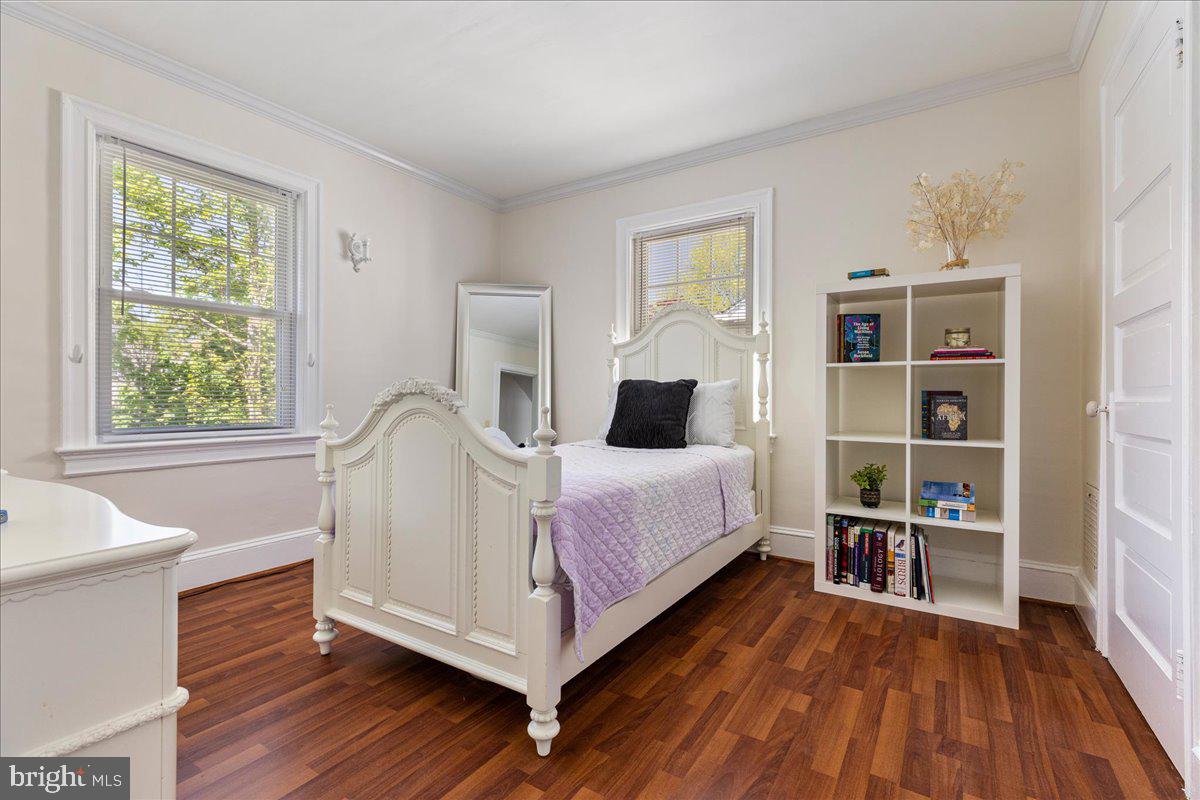 28 Jefferson Road Princeton, NJ 08540 - Photo 18 of 25 a spacious bedroom with a bed and a wooden floor