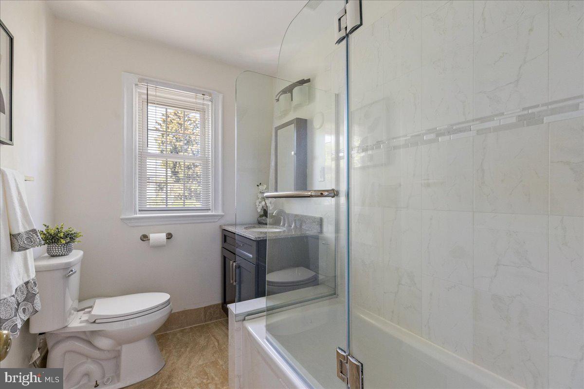 28 Jefferson Road Princeton, NJ 08540 - Photo 19 of 25 a bathroom with a sink a toilet and shower